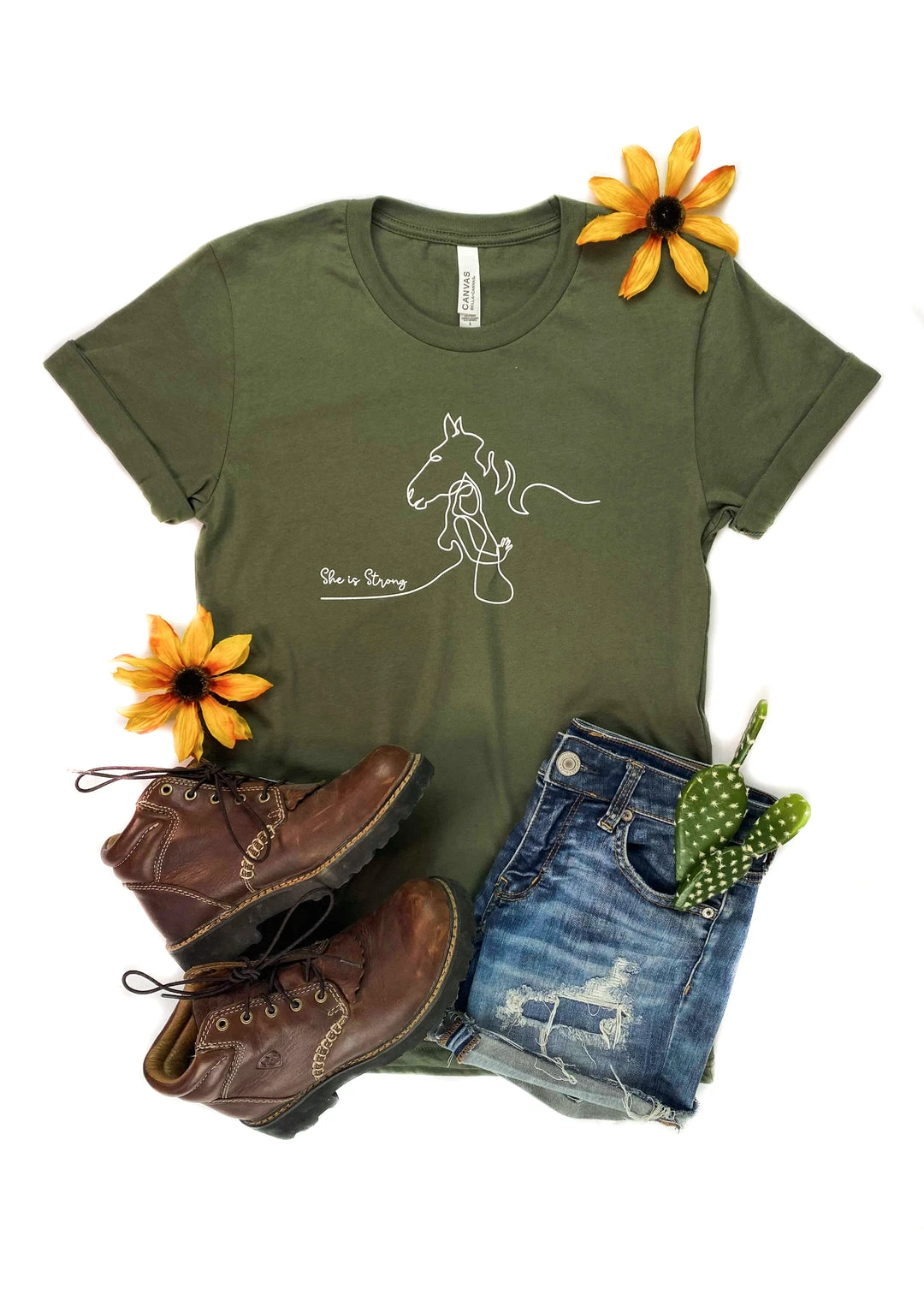 The Cinchy Cowgirl She Is Strong Horse Army Green Graphic Tee | Short Sleeve T-Shirt 3 The Cinchy Cowgirl Clothing She Is Strong Horse Army Green Short Sleeve Graphic Tee
