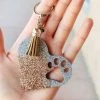 The Cinchy Cowgirl Champagne & Holographic Silver Paw Print Heart Keychain Accessories, Gifts & More