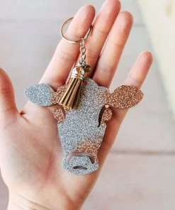 The Cinchy Cowgirl Champagne & Holographic Silver Cow Head Keychain
