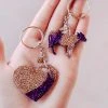 The Cinchy Cowgirl Purple & Champagne Heart & Cow Mini (Set Of 2) Keychain