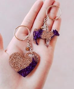 The Cinchy Cowgirl Purple & Champagne Heart & Cow Mini (Set Of 2) Keychain