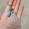 The Cinchy Cowgirl Champagne Ear Tag Keychain Resin Keychains