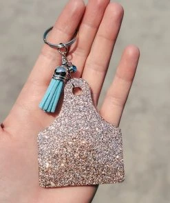 The Cinchy Cowgirl Champagne Ear Tag Keychain Resin Keychains
