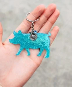 The Cinchy Cowgirl Turquoise Pig Keychain