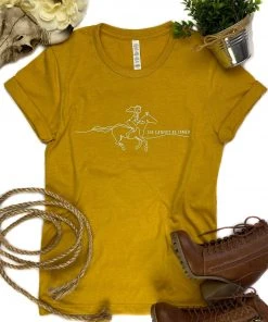 The Cinchy Cowgirl Clothing Mustard She Cannot Be Tamed Short Sleeve Graphic Tee