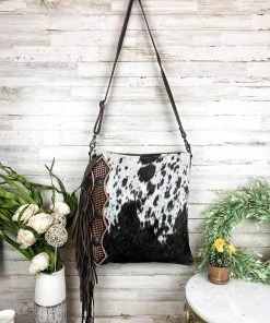Myra >> MEGA SALE << Hand Tooled Black & White Cowhide Handbag - Premium Leather Bag for Women -The Cinchy Cowgirl Store blackandwhitecowhidefringemyrahandbag2 1080x