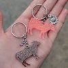 The Cinchy Cowgirl Coral & Brown Cow Mini (Set Of 2) Keychain Resin Keychains