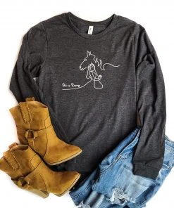 The Cinchy Cowgirl TCC Graphic Tanks & Tees Dark Heather Grey She Is Strong Long Sleeve Graphic Tee