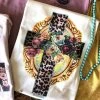 Thelattimoreclaim Cream Leopard Floral Cross Tee - Stylish Graphic Tee for Women 1 Thelattimoreclaim Cream Leopard Floral Cross Tee
