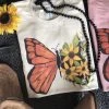 Thelattimoreclaim Cream Floral Butterfly Short Sleeve Tee Featured Graphic Tees