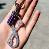 The Cinchy Cowgirl Holographic Silver Pawprint Infinity Keychain