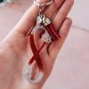The Cinchy Cowgirl Red & Silver Infinity Paw Print Keychain