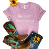 The Cinchy Cowgirl Lilac My Heart Welcomes All Short Sleeve Tee Clothing