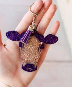The Cinchy Cowgirl Purple & Champagne Cow Head Keychain