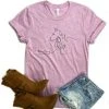 The Cinchy Cowgirl Clothing She Is Strong Horse Lilac Short Sleeve Graphic Tee